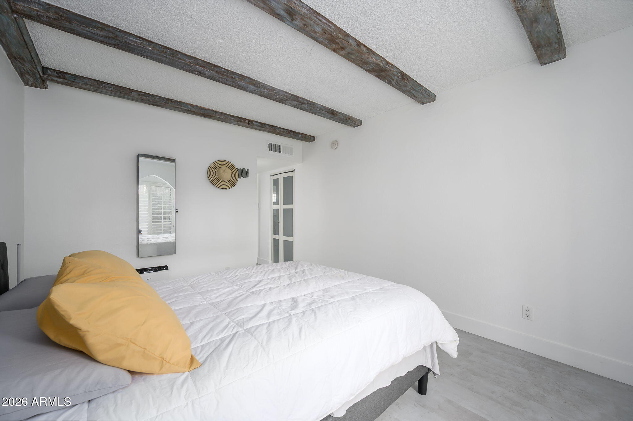 1004 East Osborn Road, Unit B Phoenix, AZ 85014 - Photo 10 of 22 a bedroom with a bed and a night stand