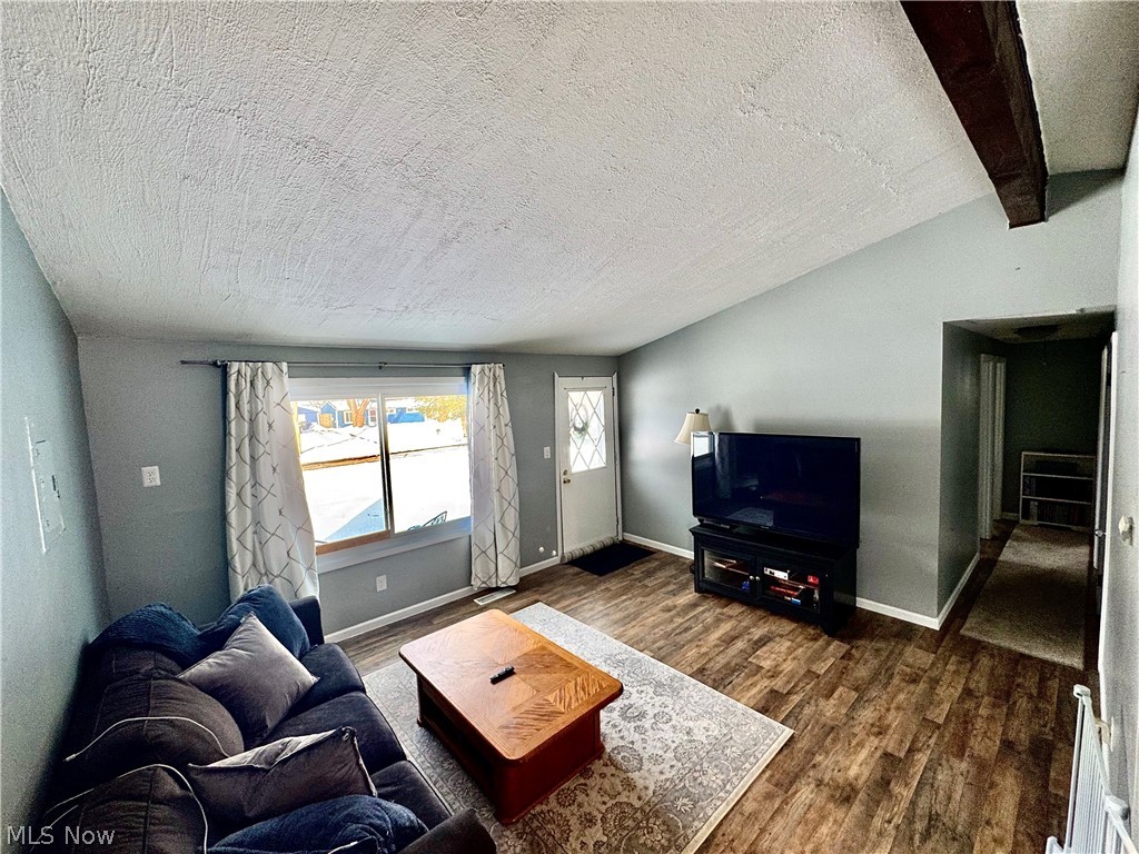 2852 Shelly Road Ravenna, OH 44266 - Photo 16 of 30 Living area featuring dark wood finished floors and beam ceiling