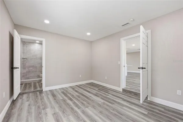 a view of wooden floor in an empty room