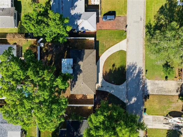 an aerial view of a house with a swimming pool