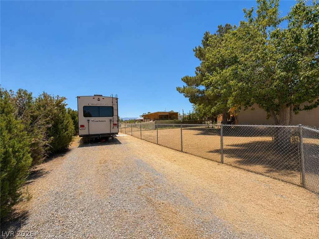 1611 West Blosser Ranch Road Pahrump, NV 89060 - Photo 3 of 25 A fenced yard provides secure outdoor living space.