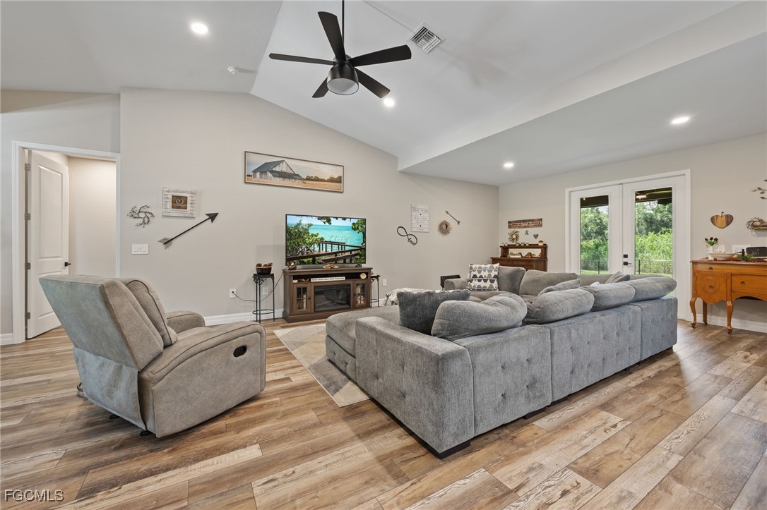 2391 Lippincott Road Alva, FL 33920 - Photo 13 of 50 a living room with furniture and a flat screen tv