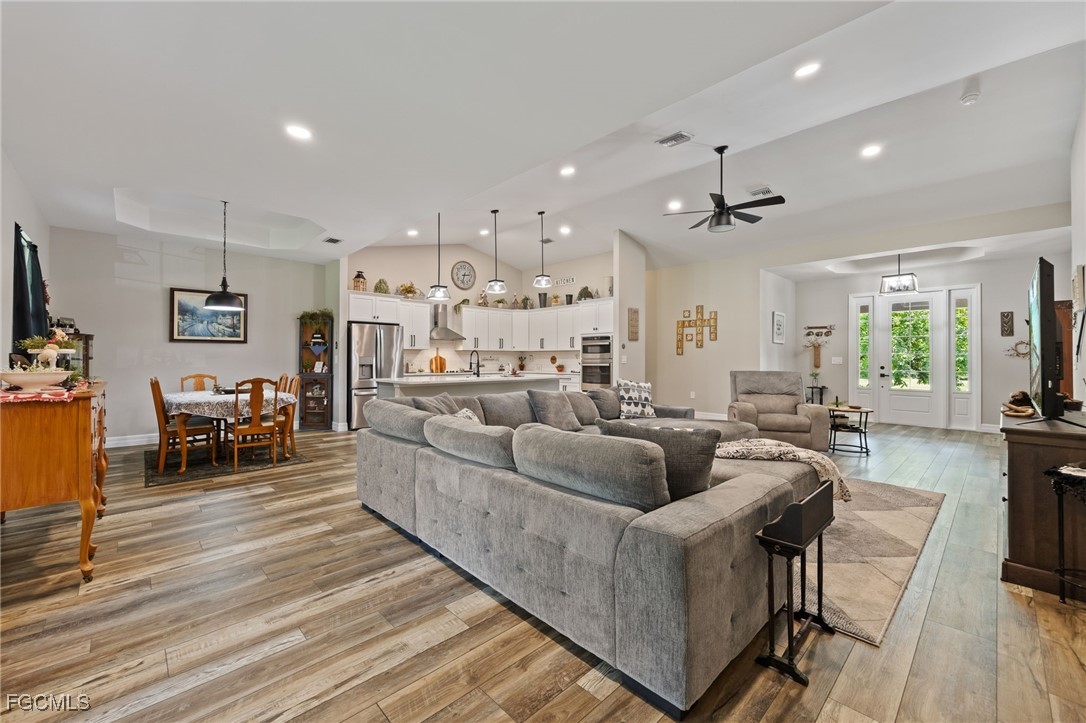 2391 Lippincott Road Alva, FL 33920 - Photo 14 of 50 a living room with furniture and a wooden floor