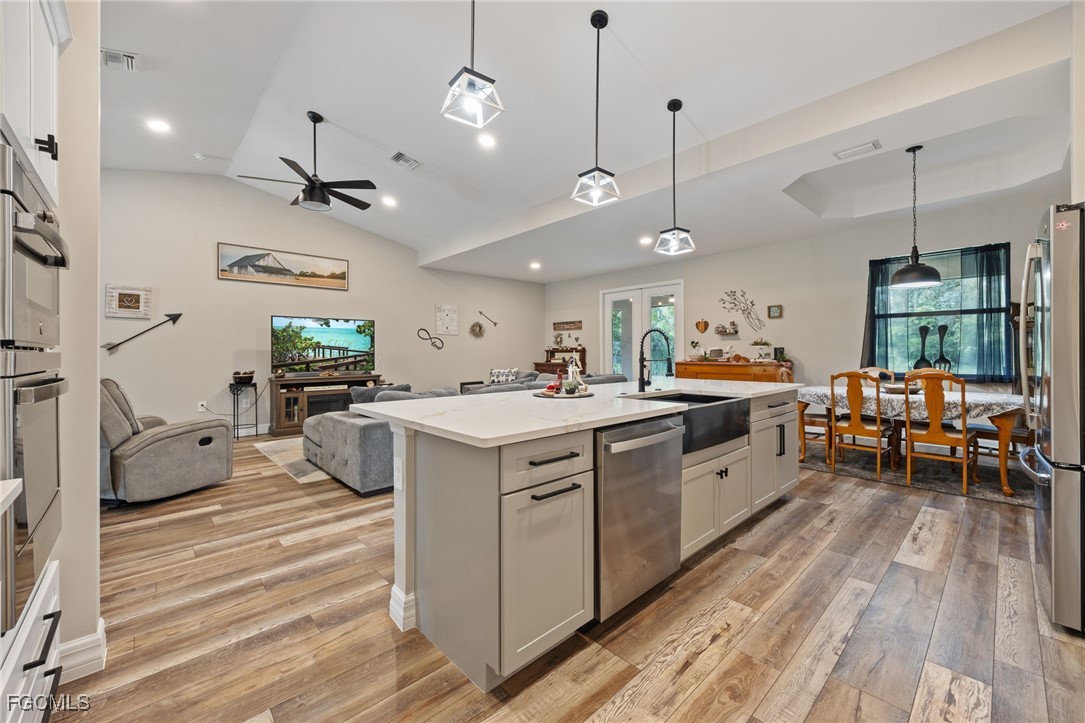 2391 Lippincott Road Alva, FL 33920 - Photo 21 of 50 a large white kitchen with lots of counter space a sink and appliances