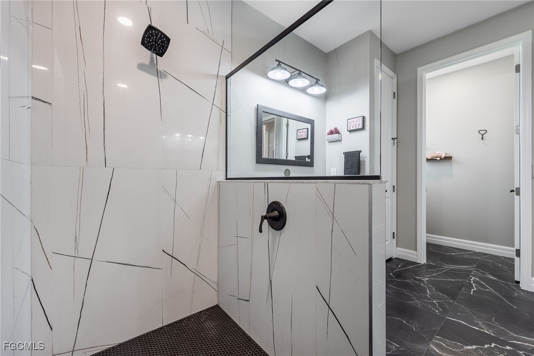 2391 Lippincott Road Alva, FL 33920 - Photo 27 of 50 a bathroom with a shower