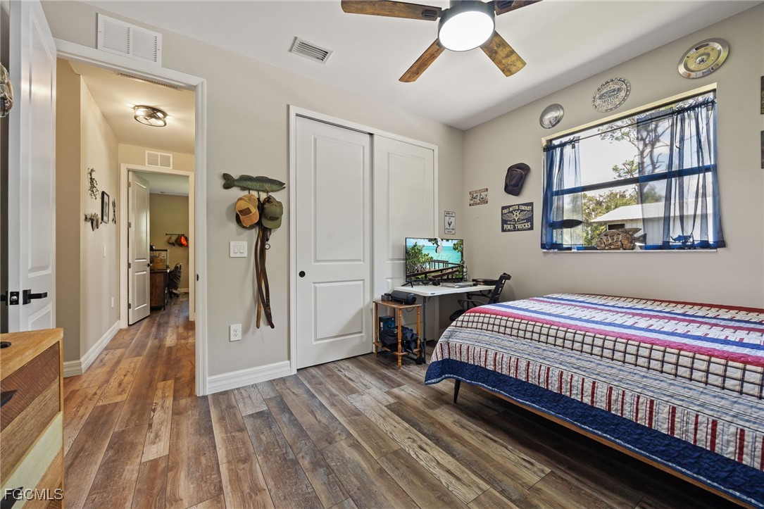 2391 Lippincott Road Alva, FL 33920 - Photo 30 of 50 a bedroom with a bed and a window