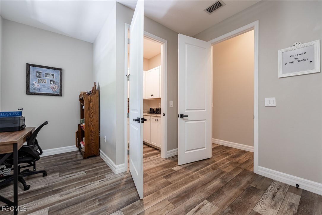 2391 Lippincott Road Alva, FL 33920 - Photo 36 of 50 a view of a room with wooden floor and furniture