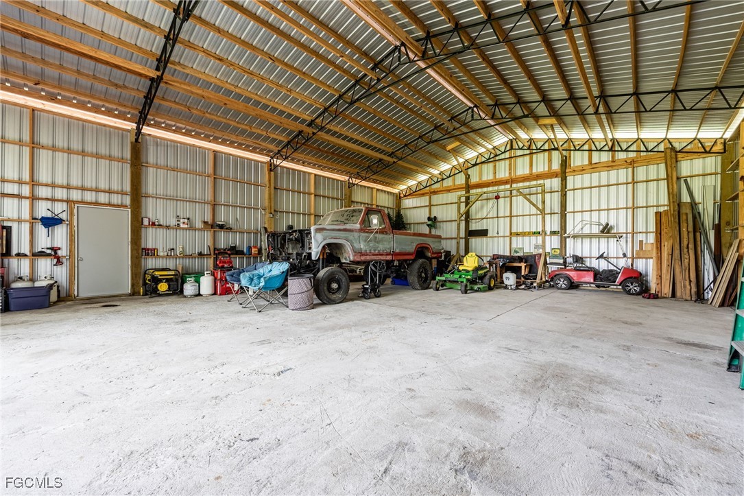 2391 Lippincott Road Alva, FL 33920 - Photo 45 of 50 a big room with lots of storage and utility