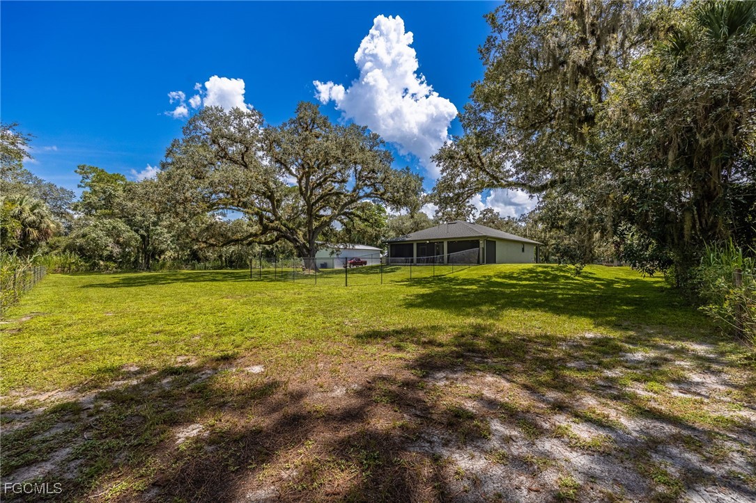2391 Lippincott Road Alva, FL 33920 - Photo 46 of 50 a view of a house with a big yard