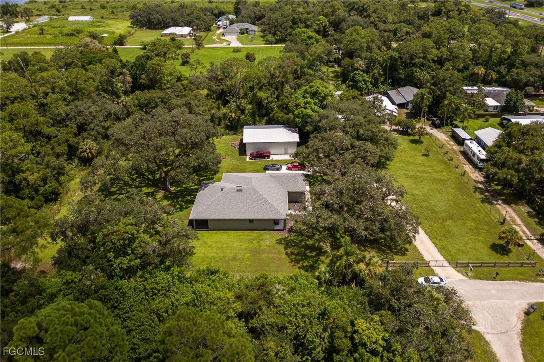 2391 Lippincott Road Alva, FL 33920 - Photo 49 of 50 a view of a house with a yard