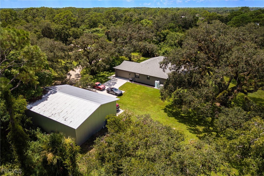 2391 Lippincott Road Alva, FL 33920 - Photo 50 of 50 an aerial view of a house with yard swimming pool and outdoor seating