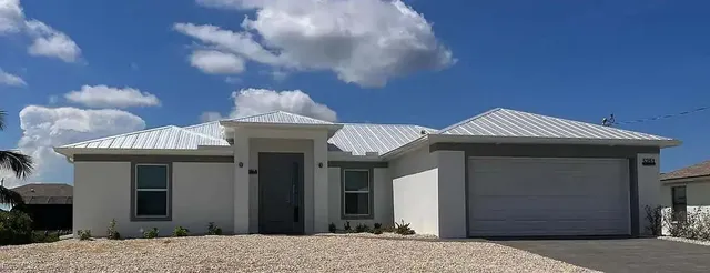 a front view of a house with a chandelier