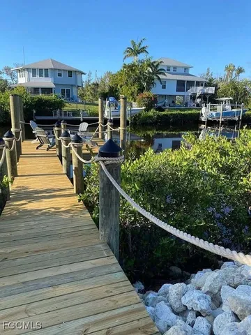 a view of swimming pool with outdoor seating and a patio
