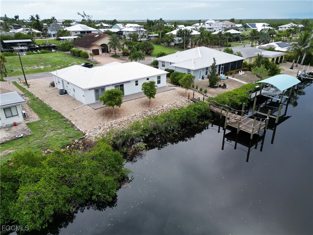 5351 Ann Arbor Drive Bokeelia, FL 33922 - Photo 21 of 21 an aerial view of a house with outdoor space patio and lake view