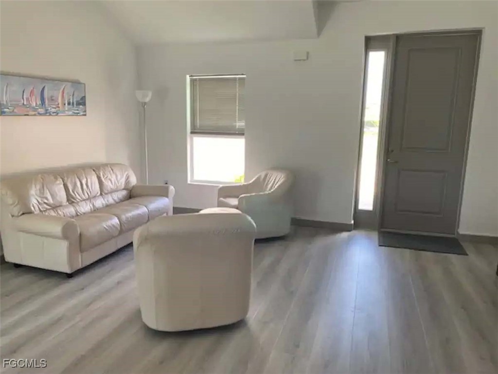 5351 Ann Arbor Drive Bokeelia, FL 33922 - Photo 4 of 21 a living room with furniture and a window