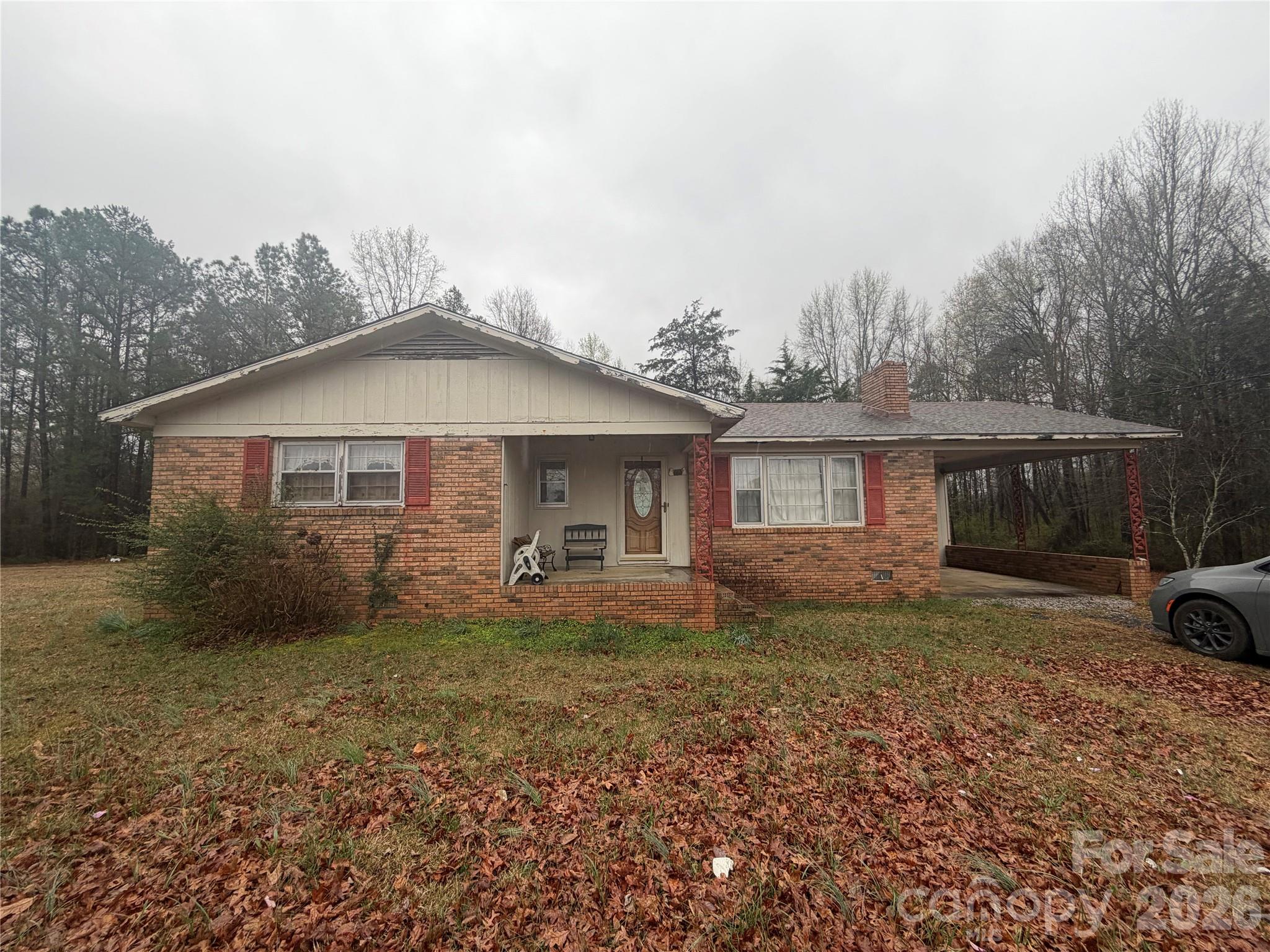 2990 Flat Creek Road Lancaster, SC 29720 - Photo 1 of 13 a front view of a house with garden