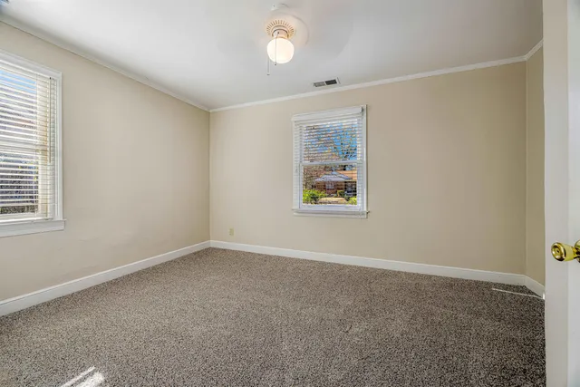 an empty room with windows