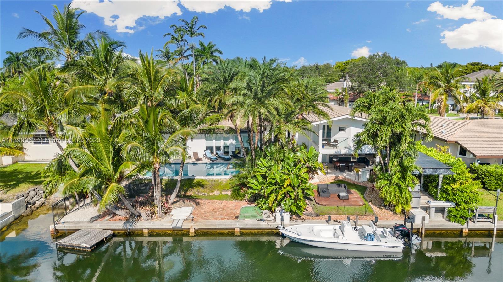 12521 Ramiro Street Coral Gables, FL 33156 - Photo 1 of 53 a view of a lake with a house
