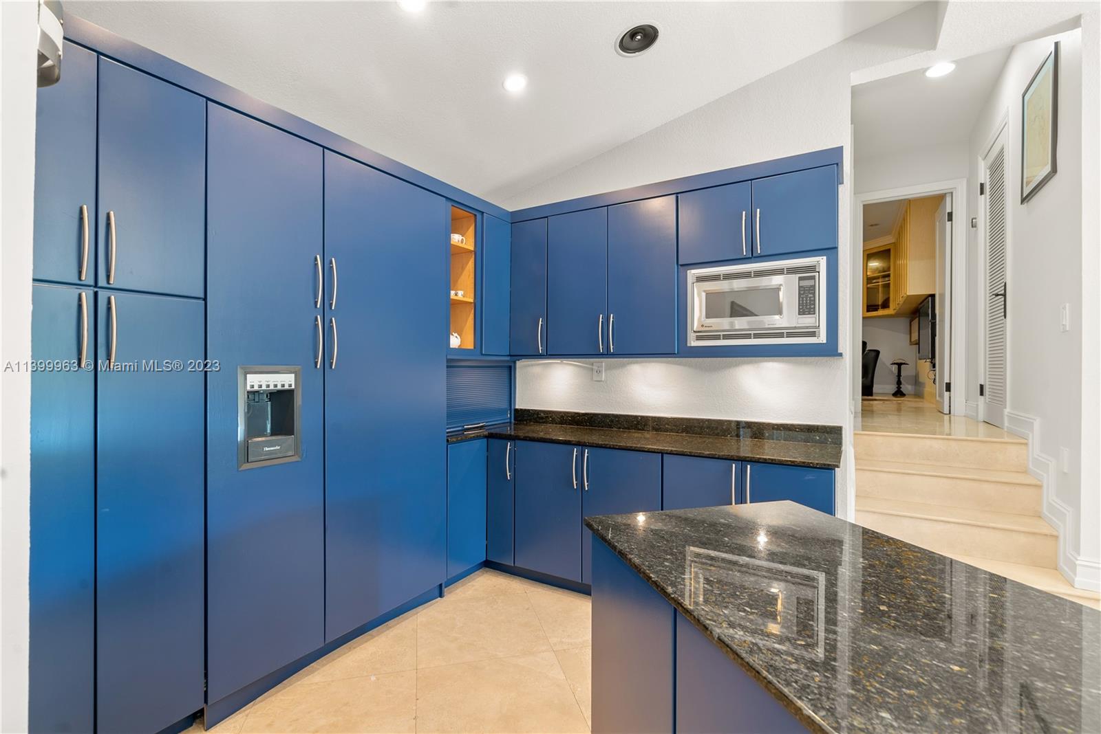 12521 Ramiro Street Coral Gables, FL 33156 - Photo 14 of 53 a kitchen with stainless steel appliances granite countertop a sink a stove and a refrigerator