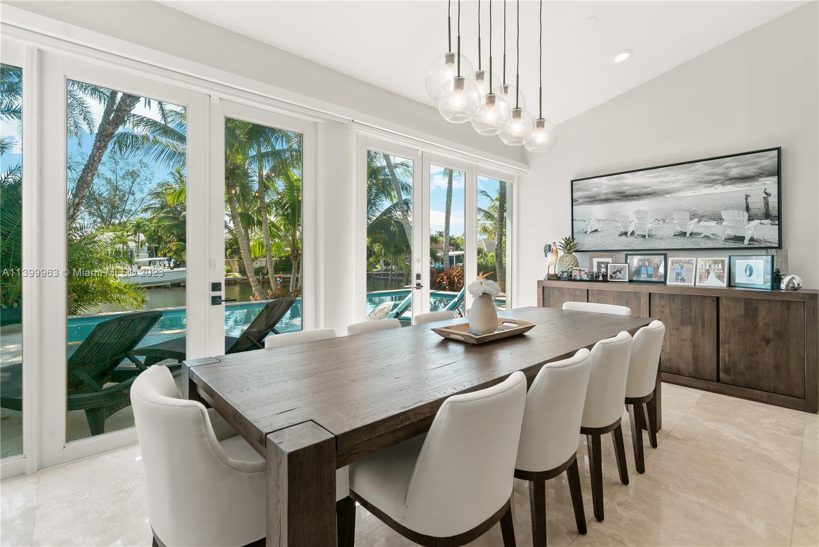 12521 Ramiro Street Coral Gables, FL 33156 - Photo 17 of 53 a view of a dining room with furniture window and outside view