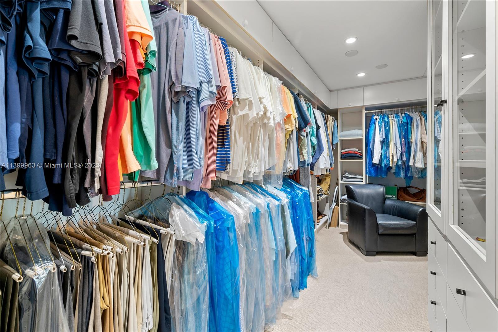 12521 Ramiro Street Coral Gables, FL 33156 - Photo 24 of 53 a view of walk in closet with clothes and shoes