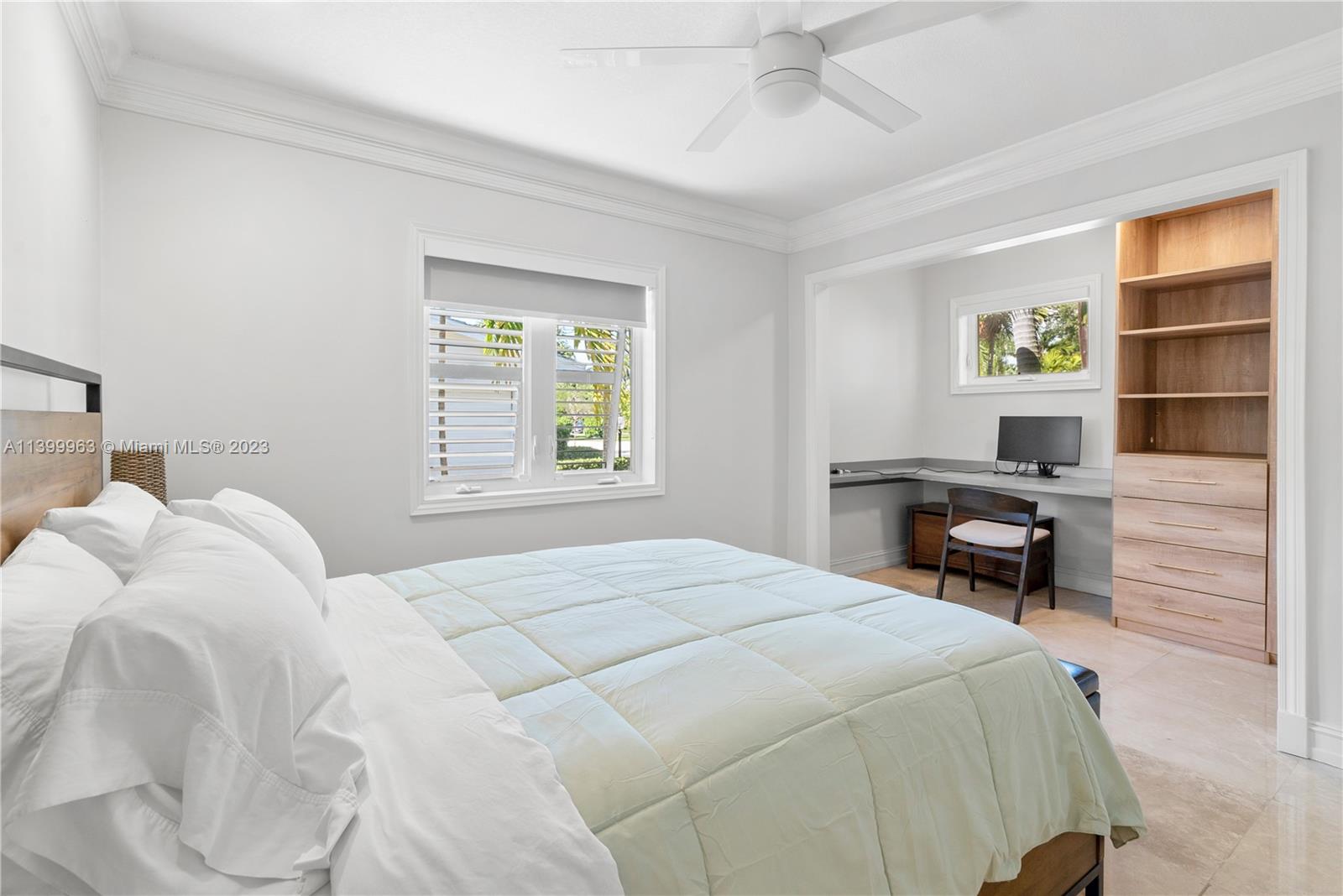 12521 Ramiro Street Coral Gables, FL 33156 - Photo 26 of 53 a bedroom with a bed and a desk