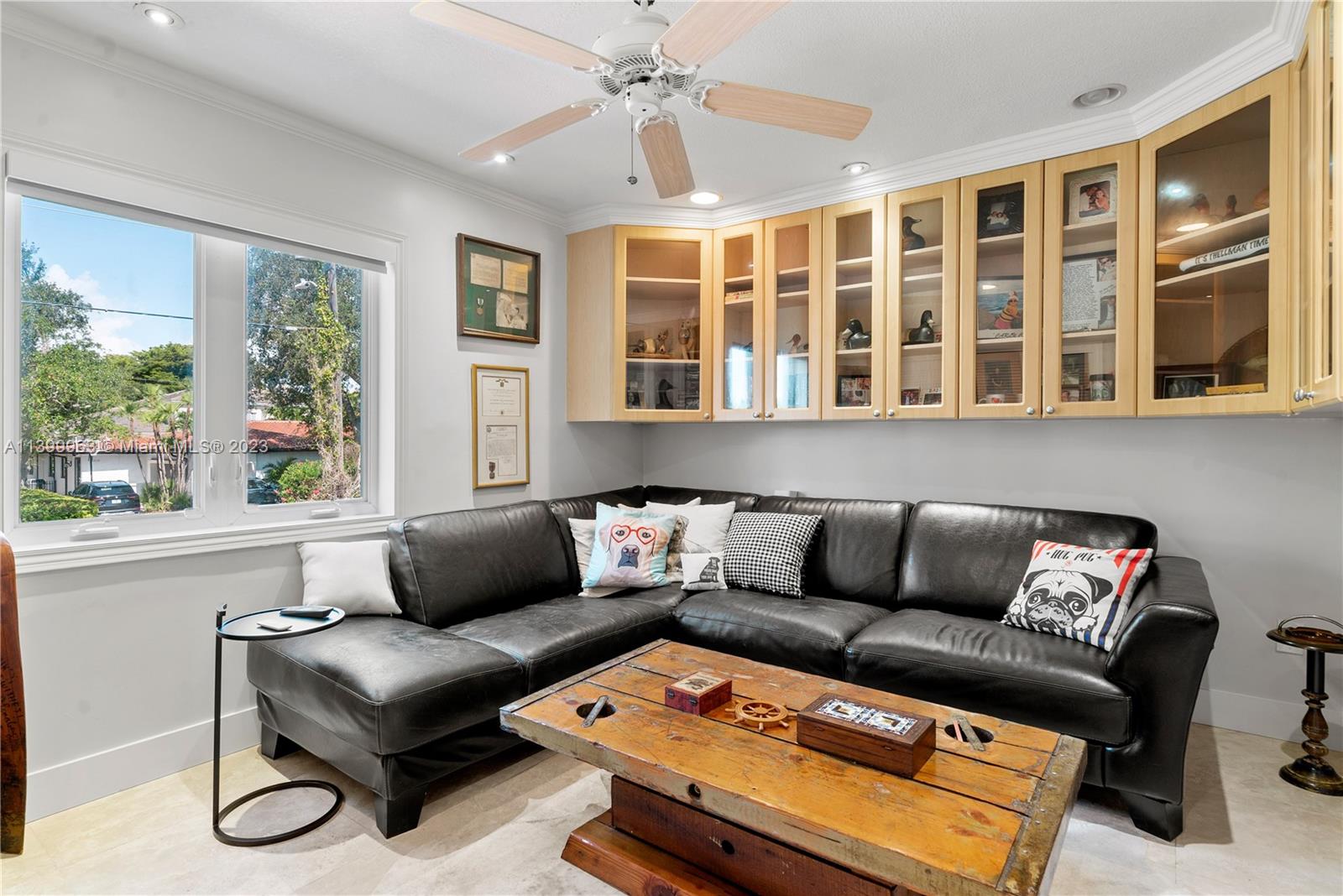 12521 Ramiro Street Coral Gables, FL 33156 - Photo 29 of 53 a living room with furniture and a window