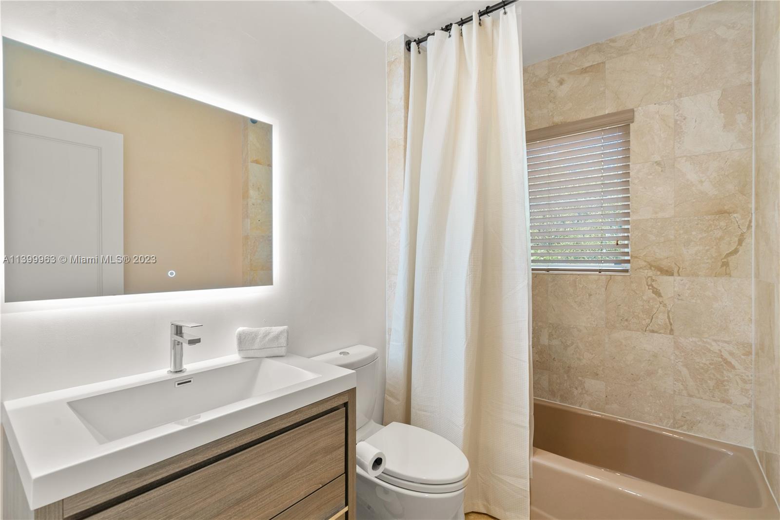 12521 Ramiro Street Coral Gables, FL 33156 - Photo 30 of 53 a bathroom with a sink a toilet and shower