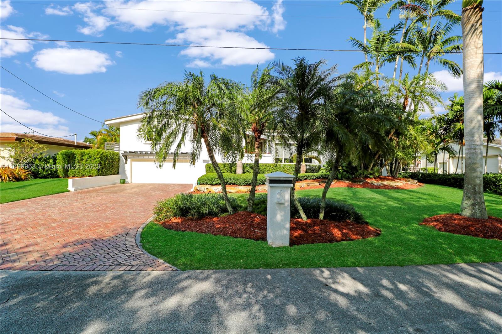 12521 Ramiro Street Coral Gables, FL 33156 - Photo 3 of 53 a front view of a house with garden and trees