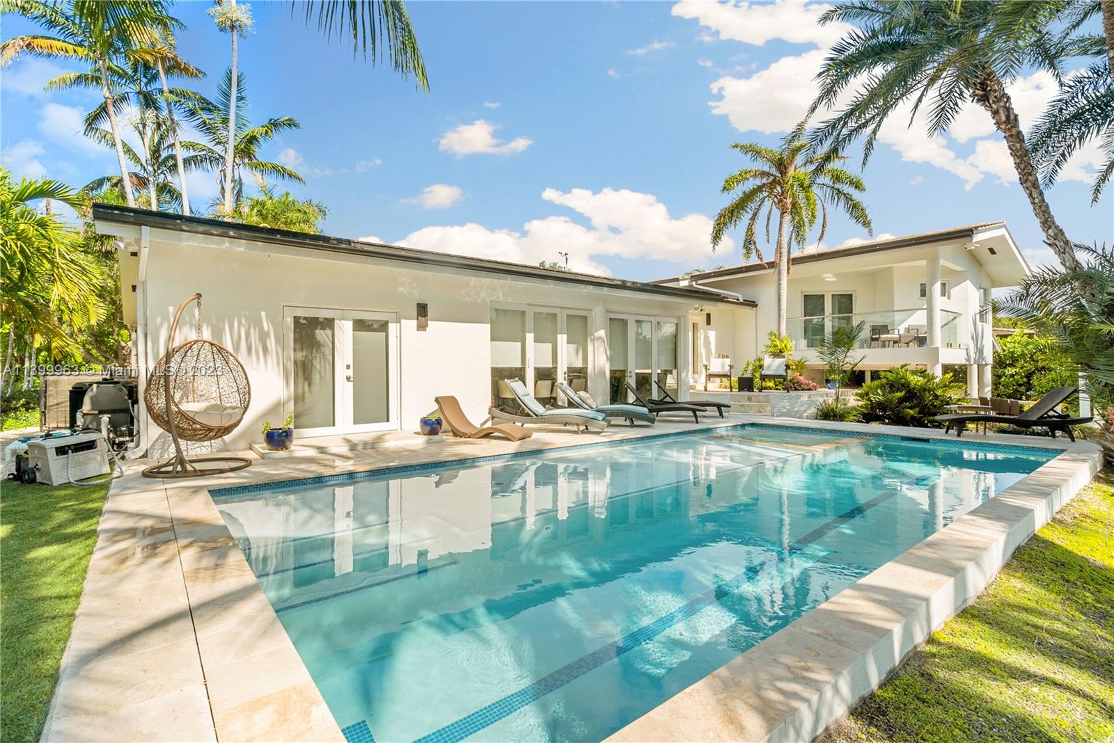 12521 Ramiro Street Coral Gables, FL 33156 - Photo 36 of 53 a view of a swimming pool with a patio