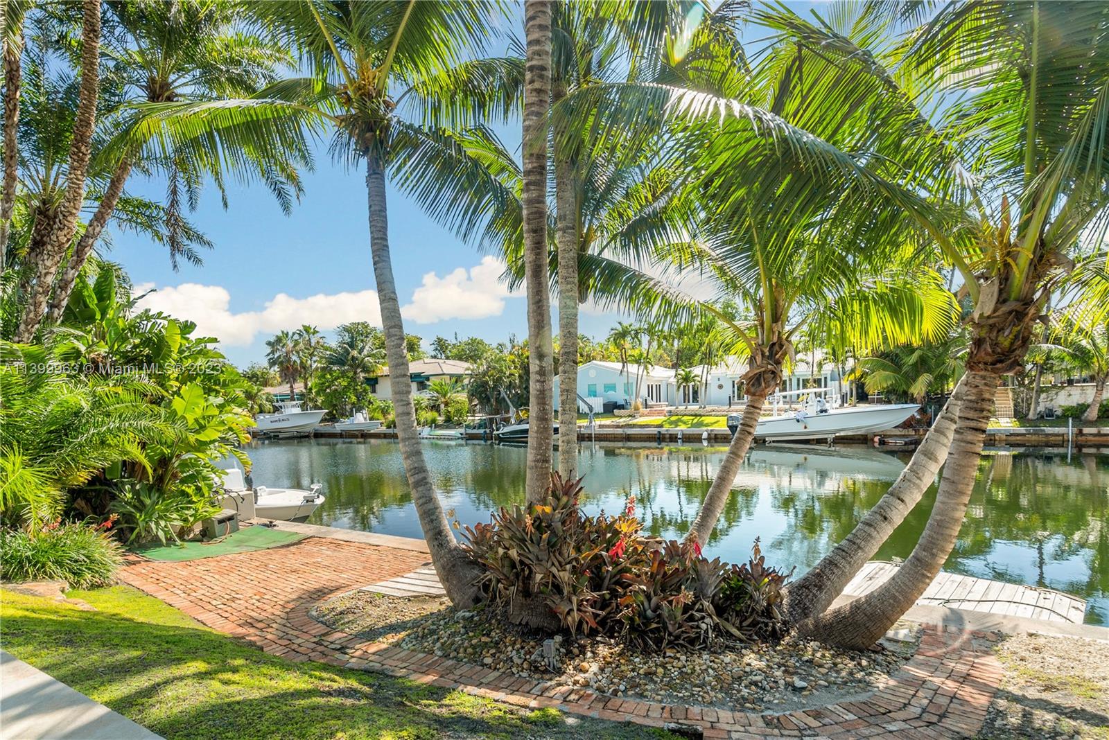 12521 Ramiro Street Coral Gables, FL 33156 - Photo 40 of 53 a view of a lake with a palm trees