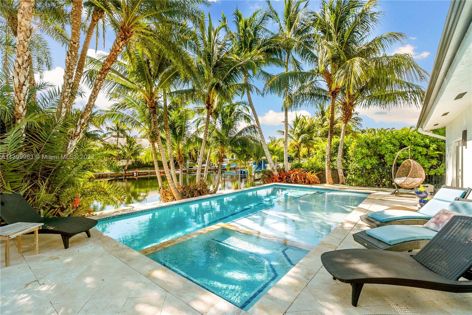 12521 Ramiro Street Coral Gables, FL 33156 - Photo 4 of 53 a view of swimming pool with lounge chair