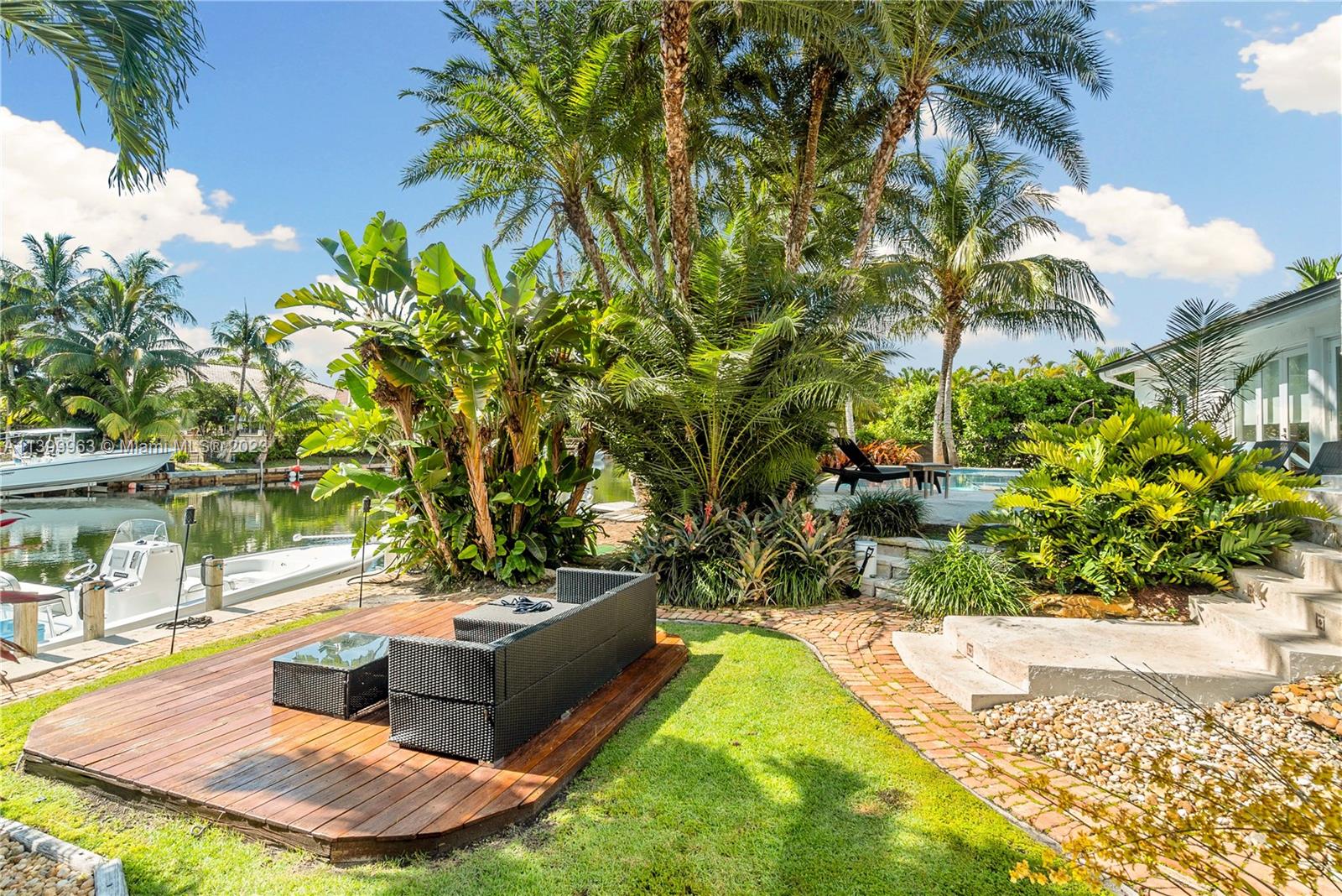 12521 Ramiro Street Coral Gables, FL 33156 - Photo 42 of 53 a view of a swimming pool with a patio