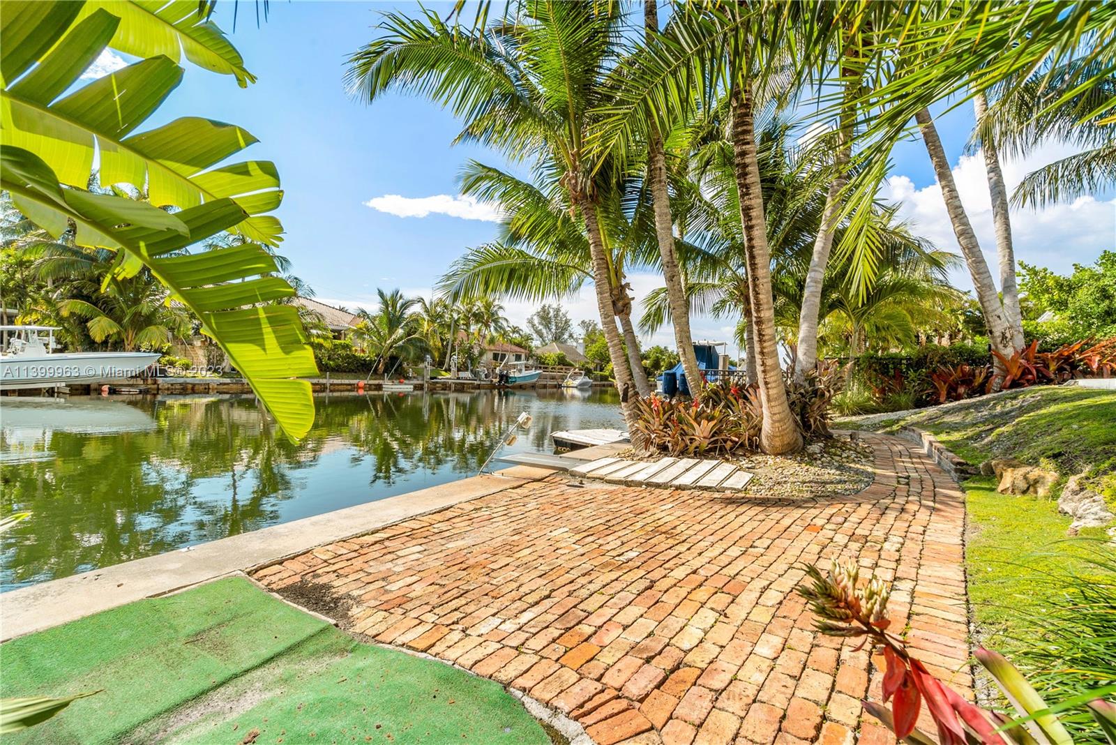 12521 Ramiro Street Coral Gables, FL 33156 - Photo 43 of 53 a view of swimming pool with a garden
