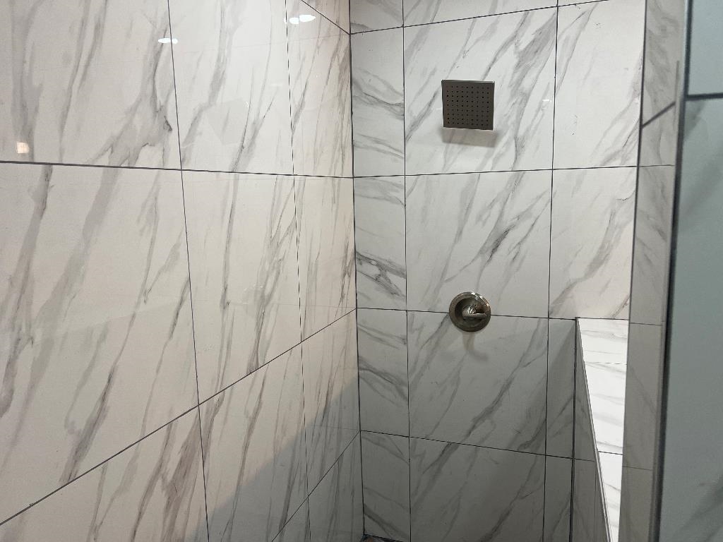 4566 Independent Road Bartlett, TN 38002 - Photo 13 of 23 Full bathroom featuring a tile shower