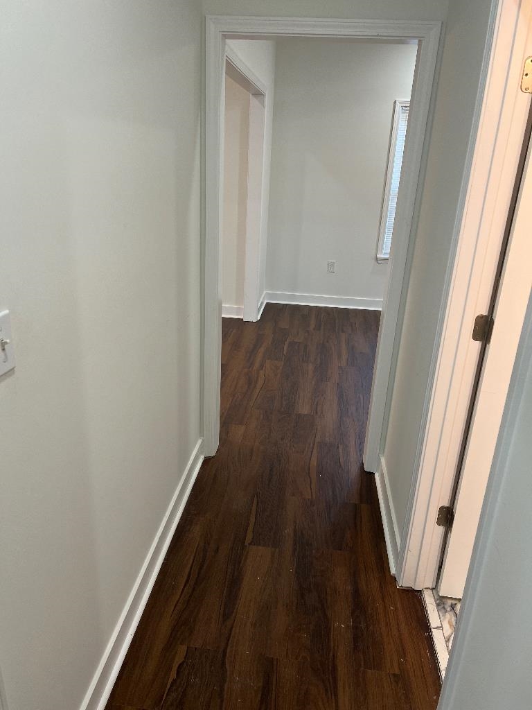 4566 Independent Road Bartlett, TN 38002 - Photo 16 of 23 Hall with dark wood finished floors and baseboards