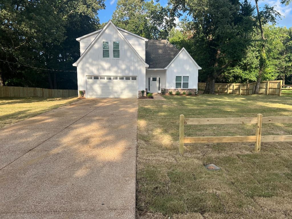4566 Independent Road Bartlett, TN 38002 - Photo 2 of 23 View of front of property with concrete driveway, a garage, and roof with shingles