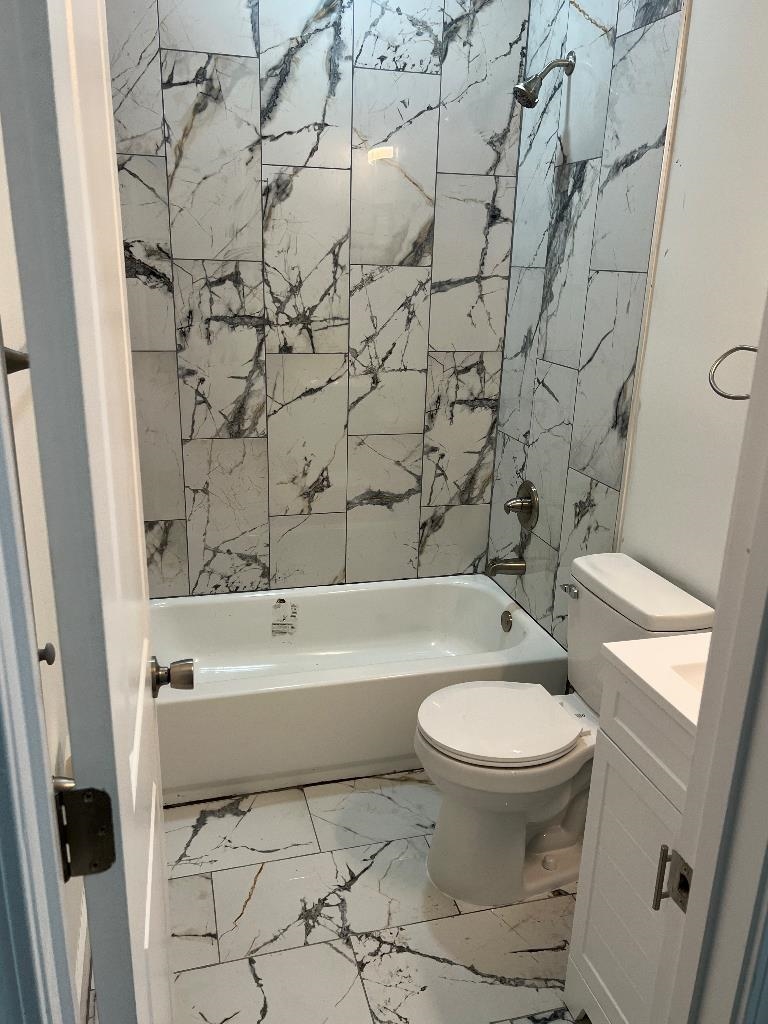 4566 Independent Road Bartlett, TN 38002 - Photo 23 of 23 Full bath featuring marble look tile flooring, shower / bath combination, and vanity