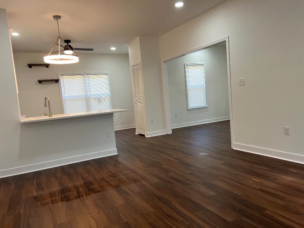 4566 Independent Road Bartlett, TN 38002 - Photo 7 of 23 Unfurnished living room with dark wood-style floors and recessed lighting