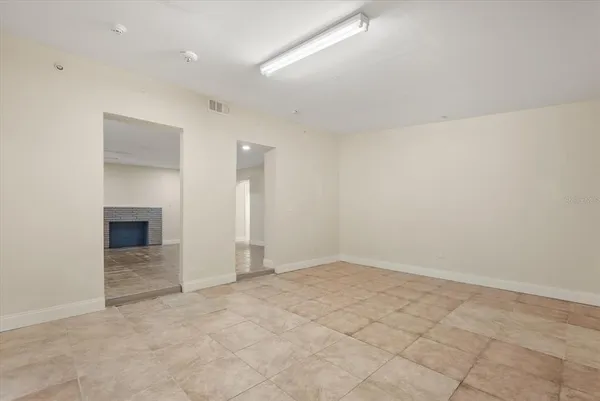 an empty room with a fireplace