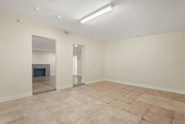 an empty room with a fireplace