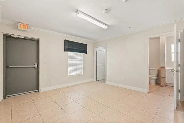 a view of an empty room with a window