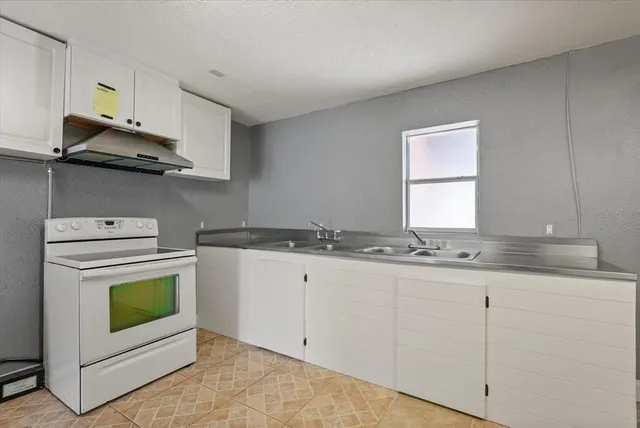 an empty view of a house with a tree