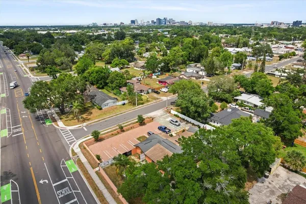 an aerial view of residential house with outdoor space and lake view