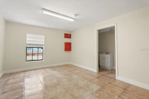 a view of an empty room with a window