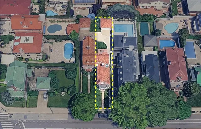 an aerial view of houses with outdoor space