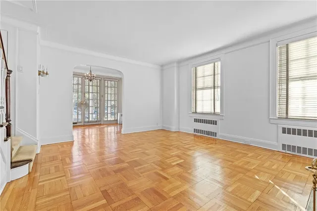 a view of an empty room with a window