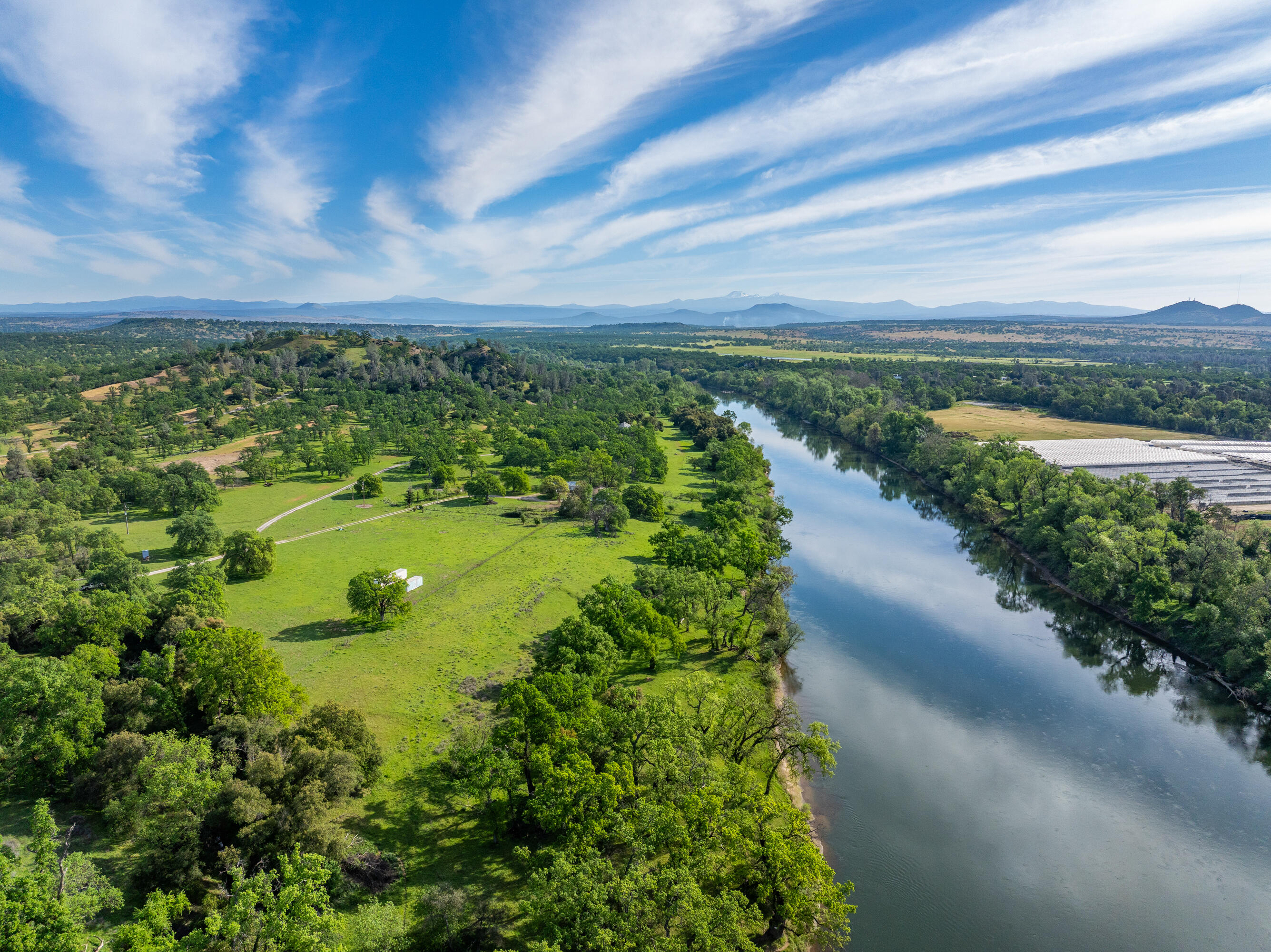 22090 Forbes Way Red Bluff, CA 96080 - Photo 3 of 28 a view of a lake with a yard