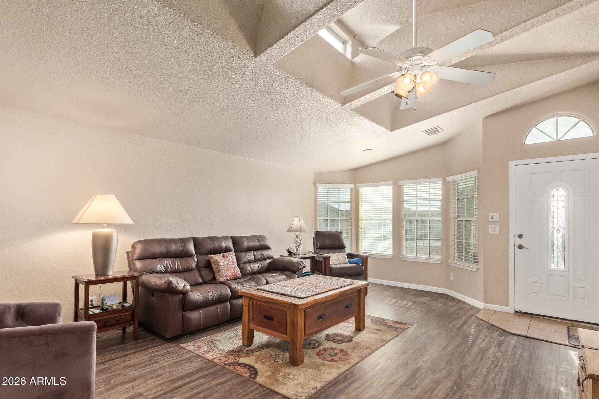 3301 South Goldfield Road, Unit 4028 Apache Junction, AZ 85119 - Photo 3 of 43 a living room with furniture and a wooden floor