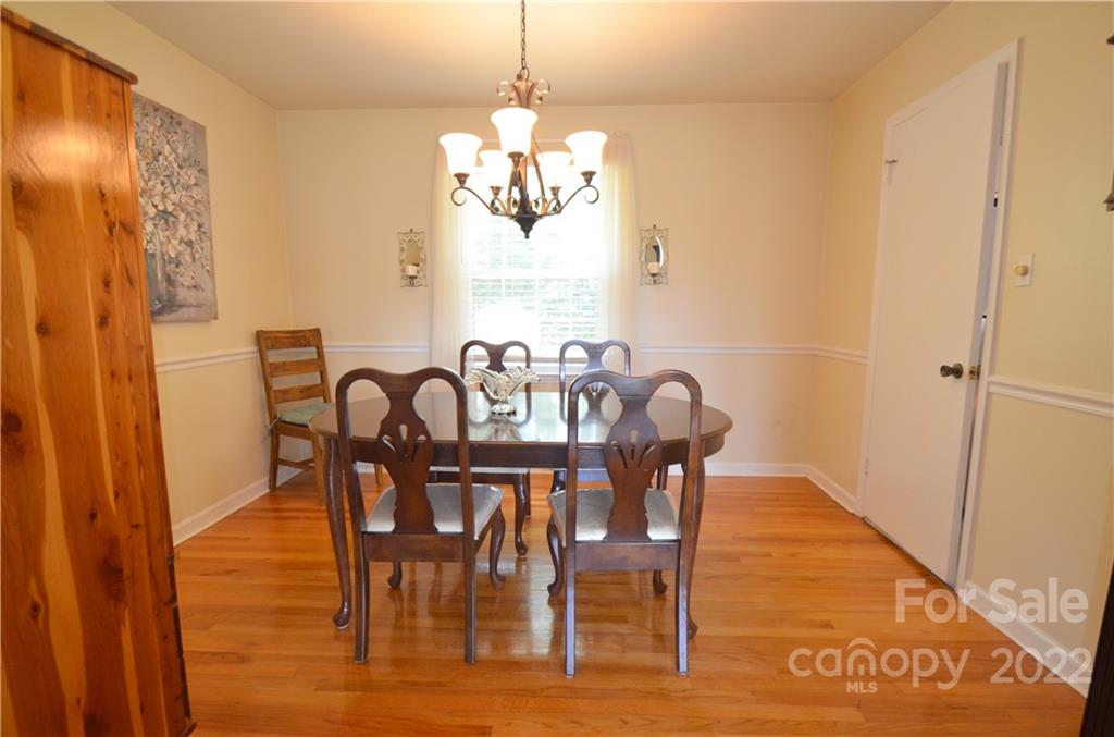 7433 Riding Trail Road Charlotte, NC 28212 - Photo 11 of 42 a view of a dining room with furniture window and wooden floor